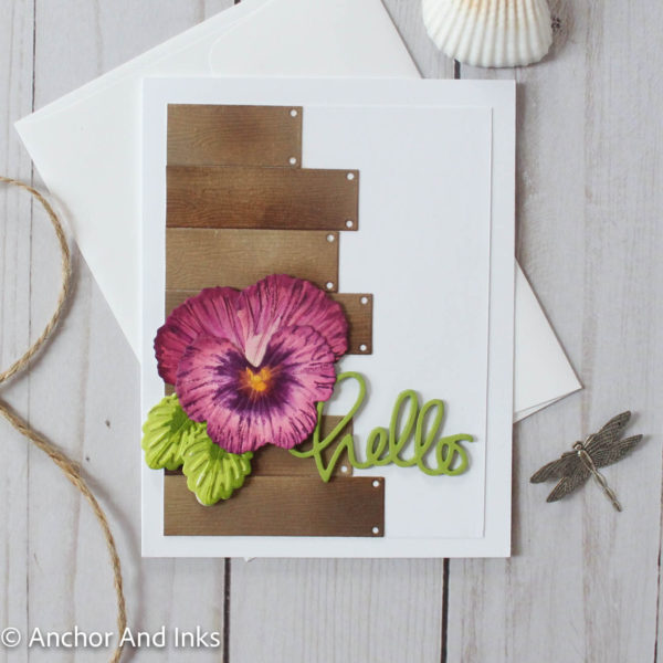 A card to say "hello" featuring a single purple pansy on a weathered wood plank background.