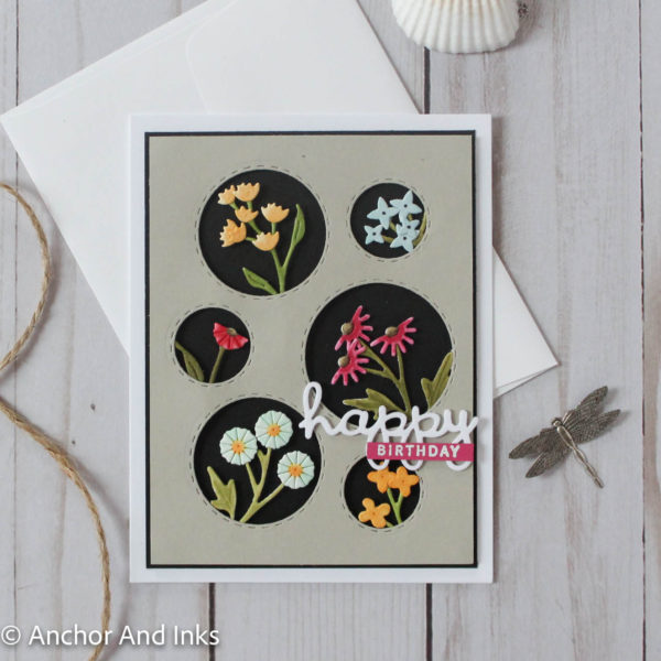 Birthday card with circular windows of various wildflowers