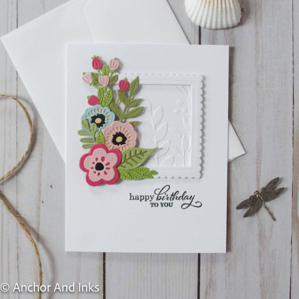 birthday card with climbing flowers on a framed embossed background