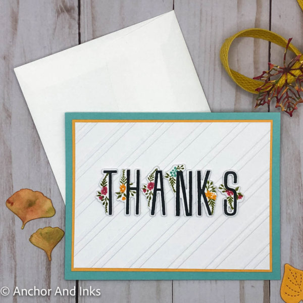 a casual thank you card with floral accents on tall thin letters spelling "thanks"