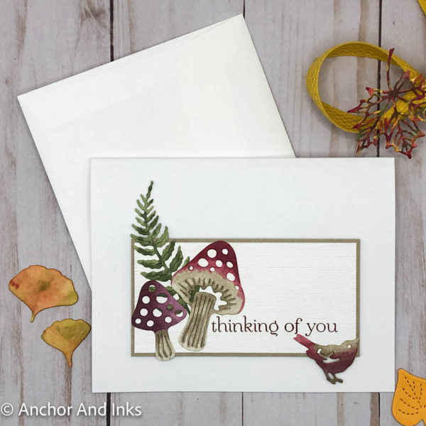 a thinking of you card featuring storybook-like mushrooms, fern and finch