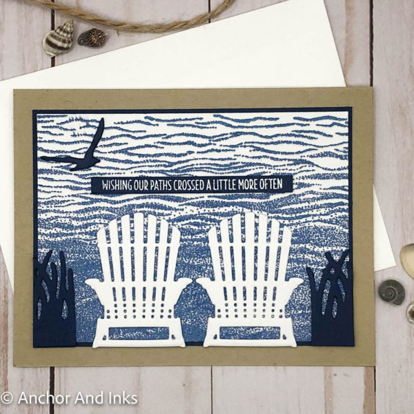 greeting card with two adirondack chairs and an ocean scene behind
