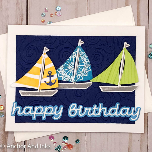 three colorful sailboats on a dark blue swirled background birthday card