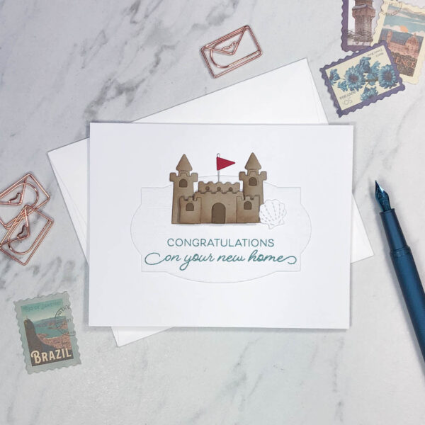 sand castle with flag new home card