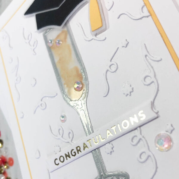 champagne flute and grad cap congratulations side view